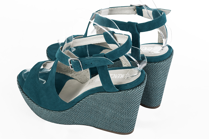 Peacock blue women's open back sandals, with crossed straps. Round toe. Very high wedge soles. Rear view - Florence KOOIJMAN